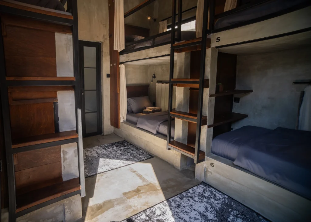 Concrete bunk bed in the Mix Dorm Room at Iron Wave Uluwatu surf hostel — photo 1