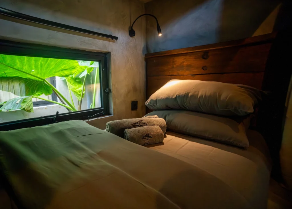 Concrete bunk bed in the Mix Dorm Room at Iron Wave Uluwatu surf hostel — photo 3